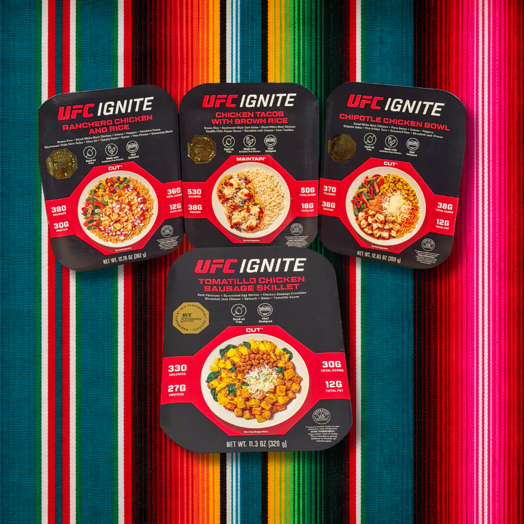 UFC Ignite Noche UFC Box: Ranchero Chicken and Rice, Chicken Tacos with Brown Rice, Chipotle Chicken Bowl and Tomatillo Chicken Sausage Skillet meals on a serape blanket